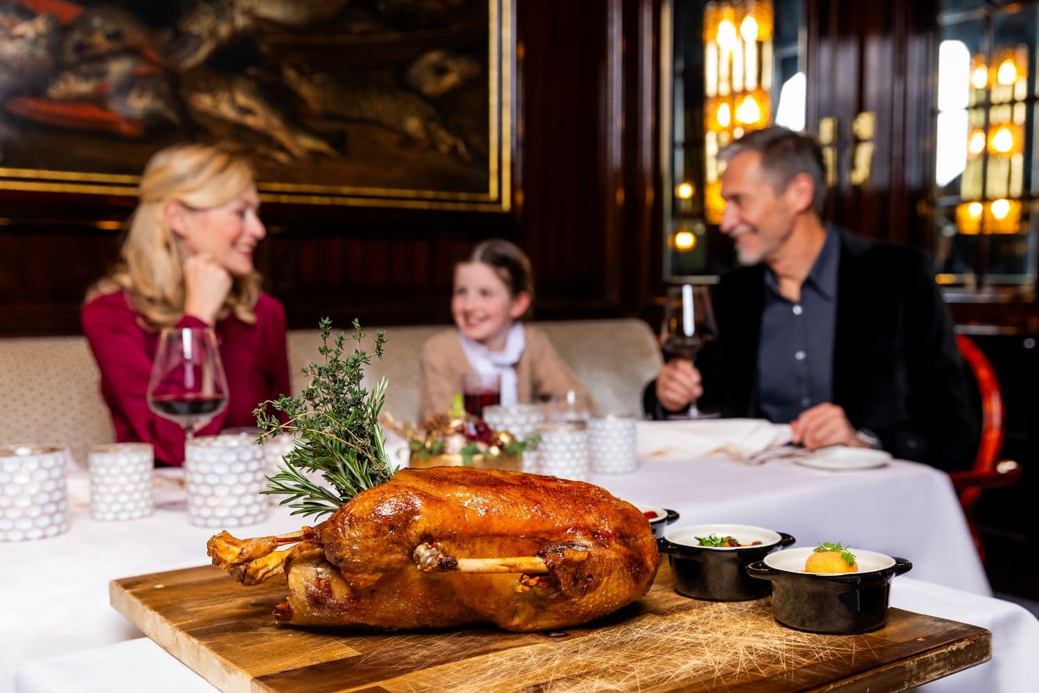 Family enjoying goose dinner at excelsior hotel ernst